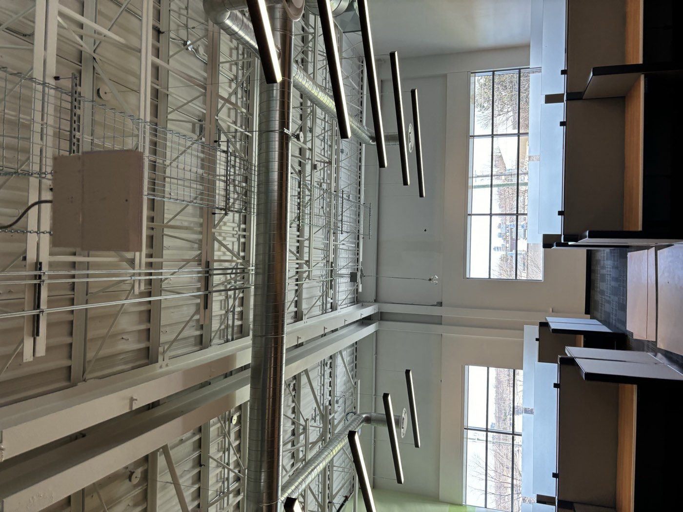 Suspended LED lighting installed in an open-ceiling commercial office