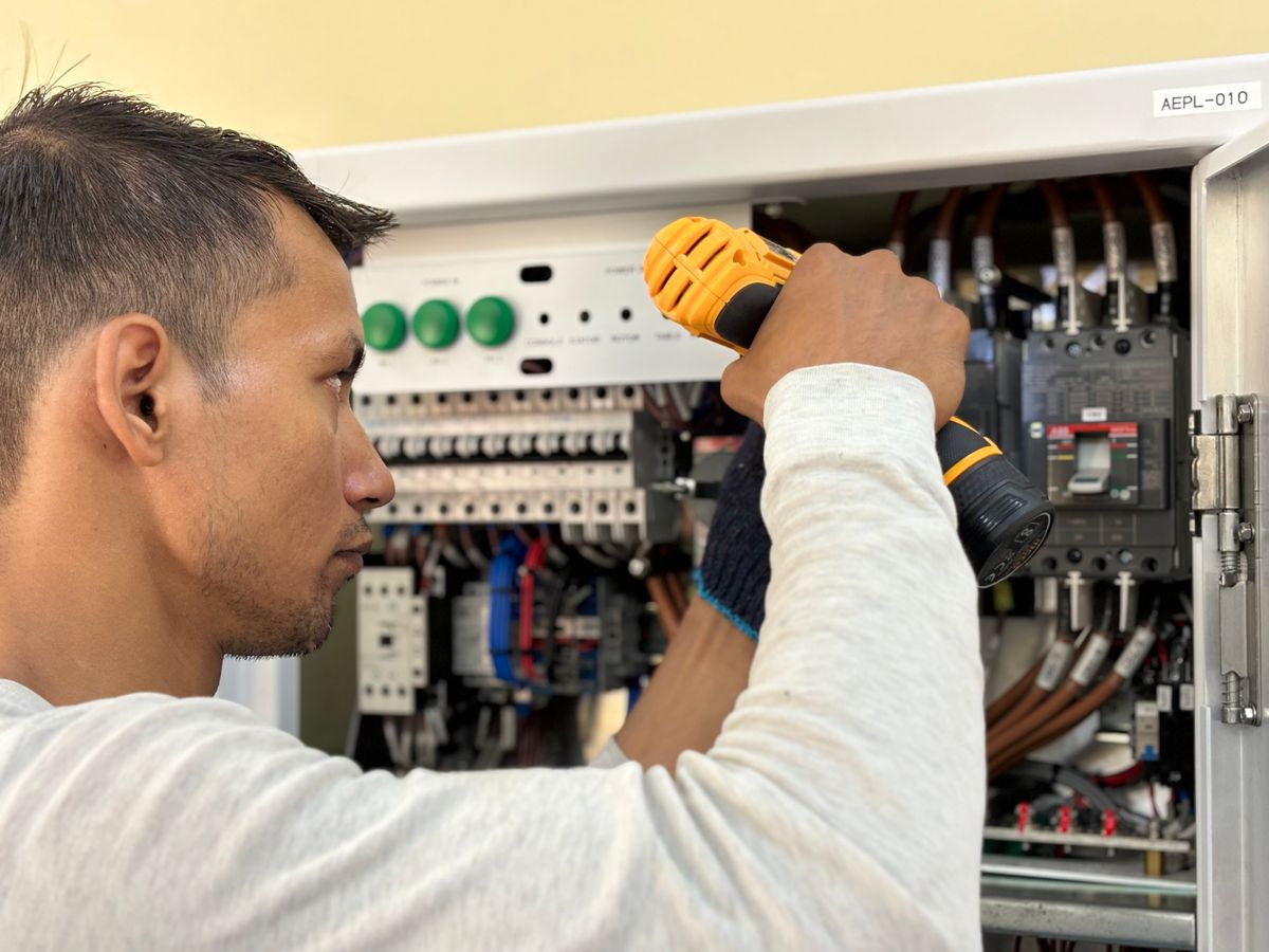 Electrician working on a panel