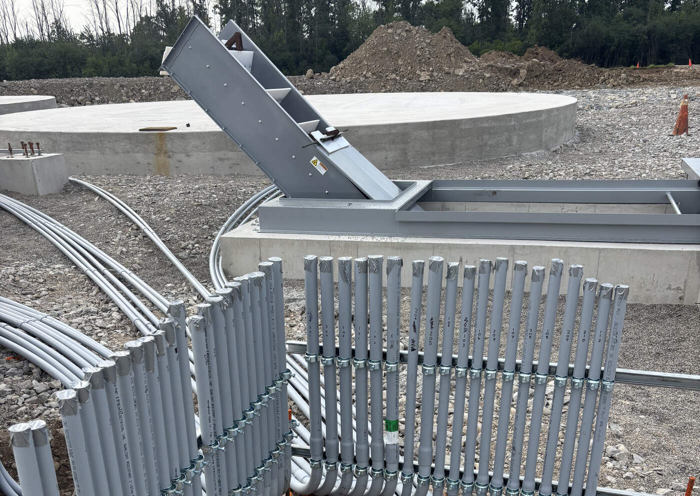 Rows of conduit racked into an outdoor distribution pad